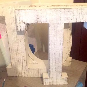 White Wooden letters spell LOTT